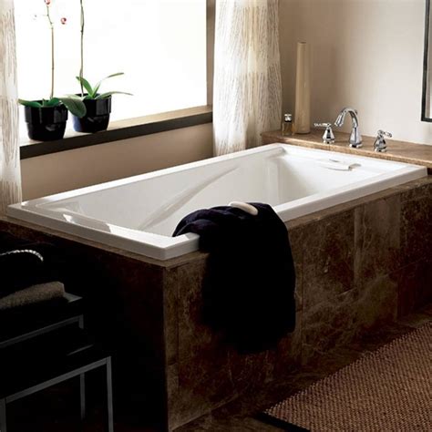 Deep soaking tub with reversible drain, white. Evolution 72x36 inch Deep Soak Bathtub - American Standard