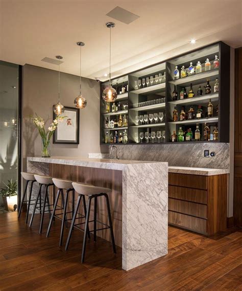 This Modern House Has A Bar That Features A Shallow Shelf With A