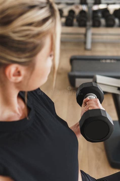 Female Hand With A Dumbbell During Biceps Curl Exercise Stock Photo