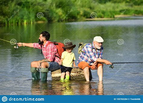 Father Teaching Son How To Fly Fish In River Anglers 3 Men Fishing On
