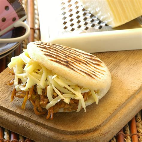 Arepa Filled With Shredded Beef And Yellow Cheese