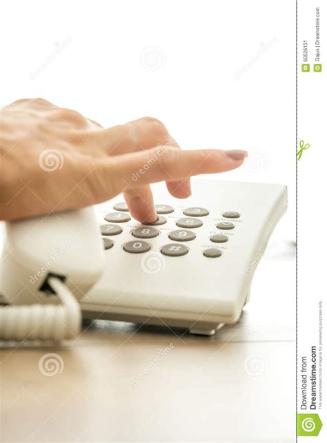 Closeup Of Female Hand Dialing A Telephone Number To Make A Per Stock