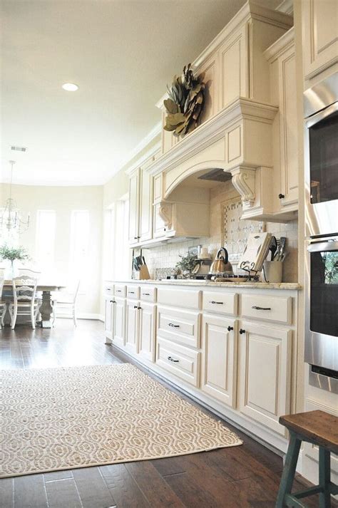 Matching colors are designed to enhance the white cabinets and other white color features in your room's design. Warm White Kitchen Paint Color: Sherwin Williams SW 6105 ...
