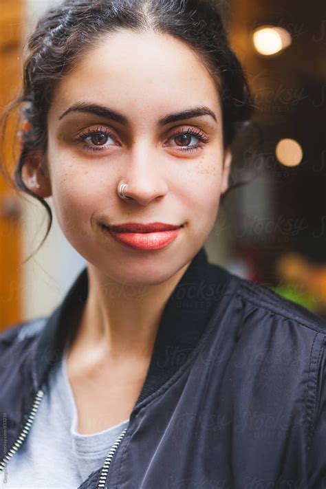 Candid Portrait Of A Smiling Mixed Race Girl By Stocksy Contributor