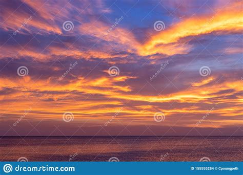 Colorful Sunset Sky Over The Ocean With Dramatic Clouds