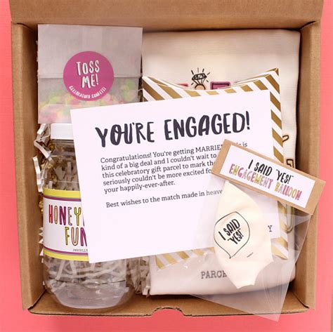Personalized engagement gifts for her from beautiful fruit arrangements to boxes of decadent chocolate dipped fruits, scrumptious mini cheesecakes, gourmet popcorn, and more, our extensive collection of gifts makes it easy to find the perfect personalized engagement gift for her that suits her taste and personality. 50+ Most Unique Engagement Gifts for Her | Emmaline Bride®
