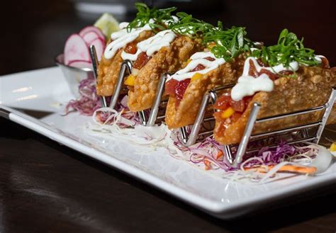 1) in medium bowl, combine the lime juice, tequila, cumin, salt and pepper and mix thoroughly. Guy Fieri's Smokehouse Norfolk - Sashimi Tacos ...