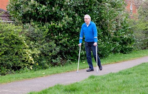 Senior Man Walking With Crutches Stock Photo Image Of Recuperate