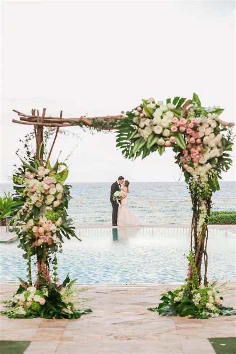 Tropical Floral Ceremony Set Up At Oceanfront Wedding At Eau Palm Beach Resort And Spa In Palm