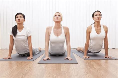 Interracial Group Of Three Beautiful Women In Yoga Position Stock