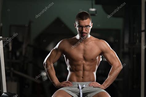 Nerd Man After Exercise Resting In Gym — Stock Photo © Ibrak 132347252