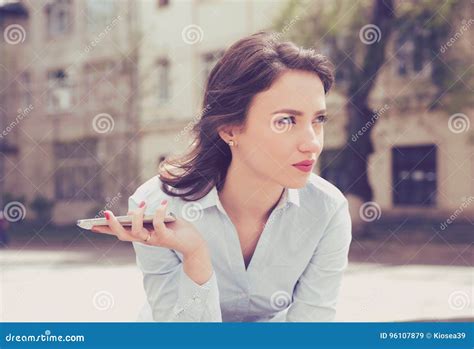 Frustrated Young Woman Waiting For A Phone Call From Her Boyfriend