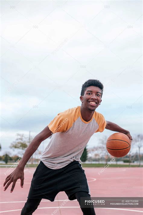 African American Teenager Playing Basketball — Individuality