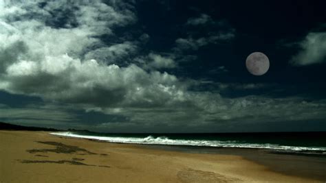 The Full Moon Over A Beautiful Sandy Beach Stock Footage