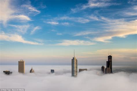 Stunning Images Of Chicago Skyscrapers Piercing Through Clouds As City