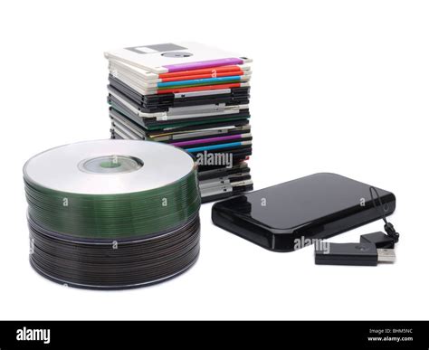 Pile Of Floppy Disks Cd Roms External Hard Drive And Pen Drive Over