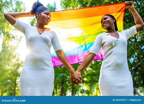 Brazilian Lesbian Couple In White Dress Spending Time Together Celebrating Engagement In Summer