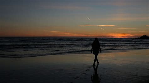 Girl Is Walking On The Beach At Sunset Stock Footage Videohive
