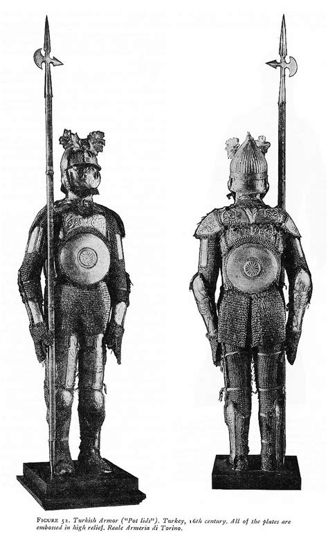 Two Medieval Armor Standing Next To Each Other