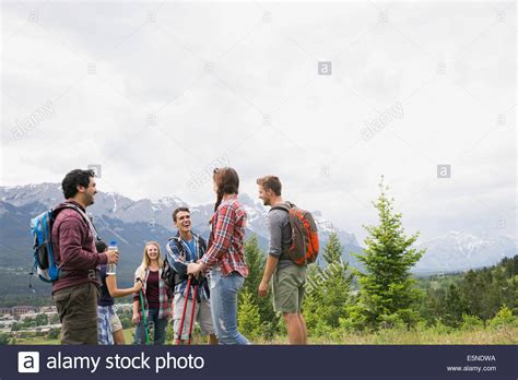 Friends Hiking Near Mountains Stock Photo Alamy