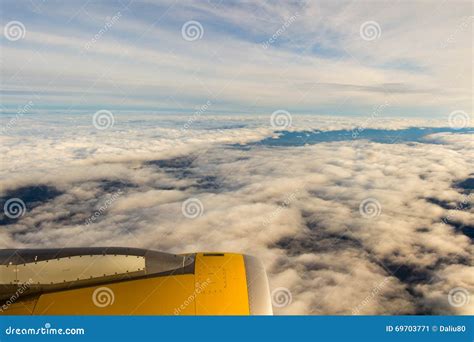 Clouds And Sky As Seen Through Window Of An Aircraftairplane Stock