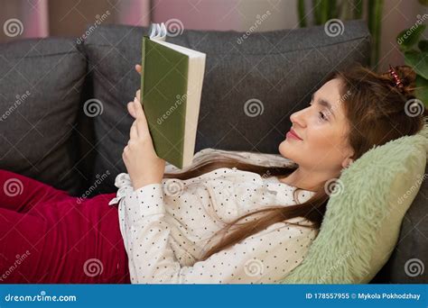 Teenager Girl Home Student Read Book Laying On Sofa Portrait Of