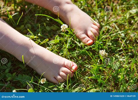 Baby Feet In The Grass Stock Photo Image Of Nature 149861620