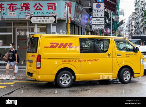 German Express Delivery Mail Company Dhl Van Seen Parked On The Streets