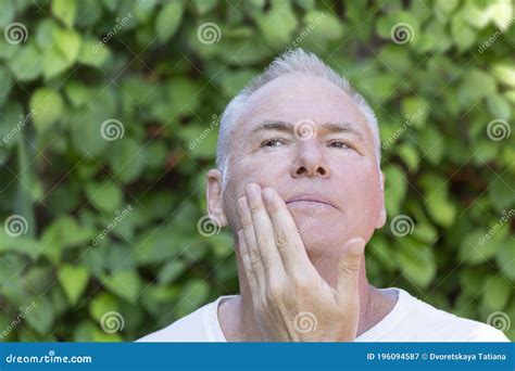 a man strokes his chin after shaving stock image image of natural friendly 196094587