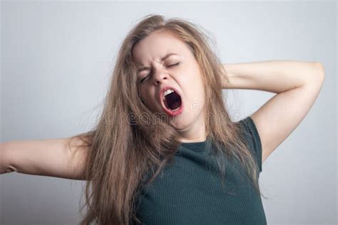 Young Caucasian Woman Girl Yawning Tired Or Sleepy With Messy Hair