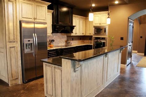Distressing a cabinet is basically taking something new or unfinished and making it look like it is old. Distressed Cabinets | Distressed cabinets, Home kitchens, Country kitchen