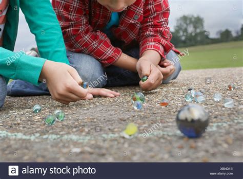 Two Children Playing Marbles Stock Photos And Two Children Playing