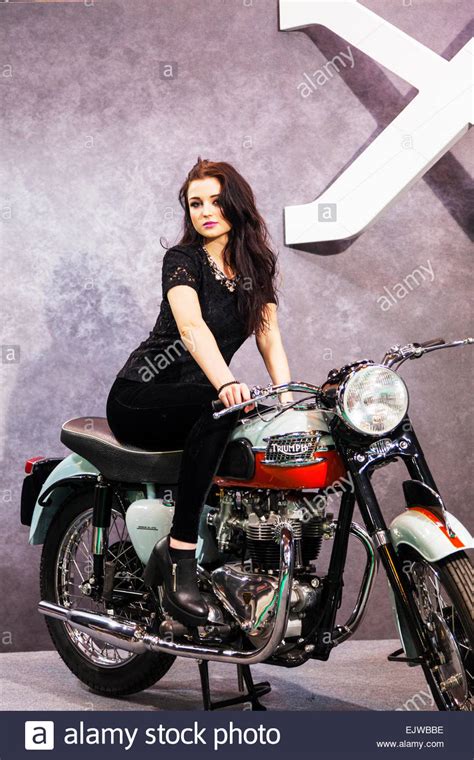 Motorcycle photoshoot poses for girls. Pretty girl brunette posing on Triumph motorbike ...