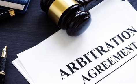 Arbitration agreement and gavel on a desk.
