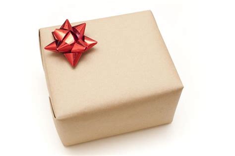 The 25 best 18th birthday gifts from parents. Photo of Plain brown paper wrapped gift box | Free ...