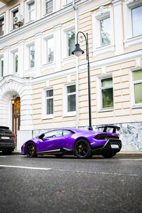 A Purple Sports Car Parked In Front Of A Building Photo Free Russia