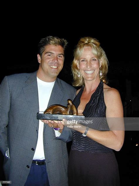 Erin Brockovich And Husband Eric Ellis Hold Up The Chec Award She