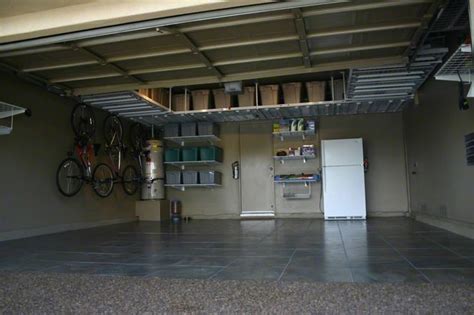 With help of lumber, totes, wooden boards, screws and some physical efforts you will be able to make shelves that would be attached to the ceilings. garage overhead storage | Garage Overhead Storage Gallery ...