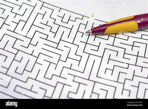 Maze Puzzle Game And Pencil To Solve Stock Photo Alamy
