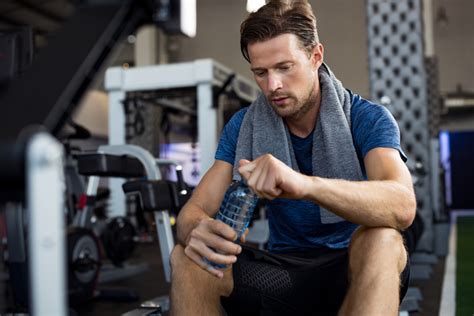 Man With Water Bottle At Gym Fitness And Wellness News