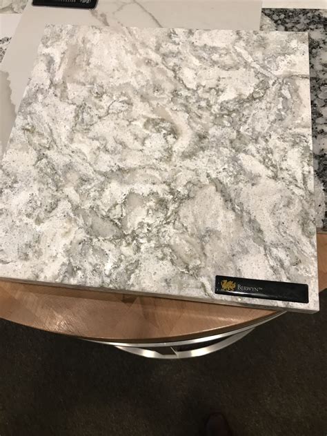 The Counter Top Is White And Black Marble