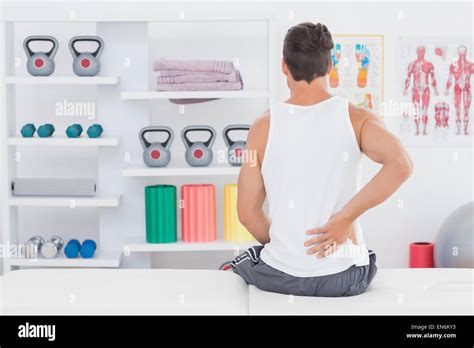 Young Man Suffering From Back Pain Stock Photo Alamy
