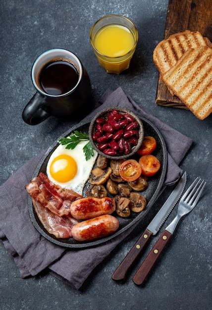 Premium Photo Full Fry Up English Breakfast With Fried Eggs Sausages