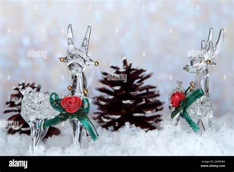 Glass Reindeer On Snow With Pine Cones Holiday Christmas Theme With