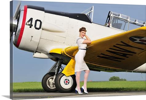 1940s Style Navy Pin Up Girl Leaning On The Wing Of A T 6 Texan Wall