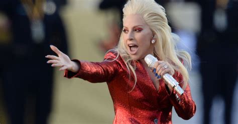 The singer stood on the podium where the ceremony was being conducted with a gold microphone in hand and wearing a full red skirt with black coat jacket. Nailed it! Lady Gaga's national anthem performance is ...