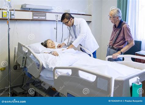 Male Doctor Examining Senior Patient Stock Photo Image Of Female