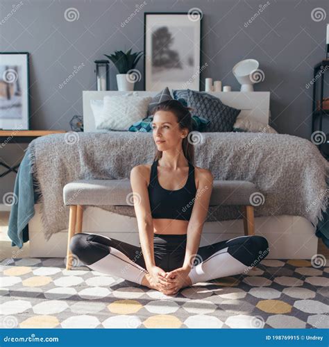 Young Woman Stretches Her Legs With Her Knees Apart Stock Image Image Of Home Outwards