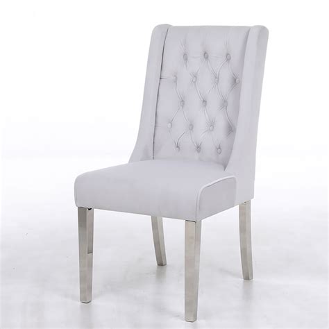 These velvet dining chairs work are perfect for a contemporary dining room. Felicity Silver Velvet Dining Chair With Chrome Legs And Ring Knocker | Picture Perfect Home