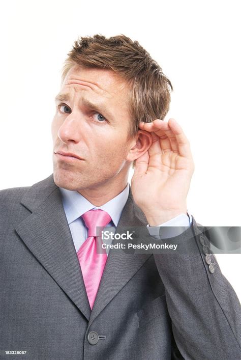 Young Man Businessman Listening Cupping Ear On White Background Stock